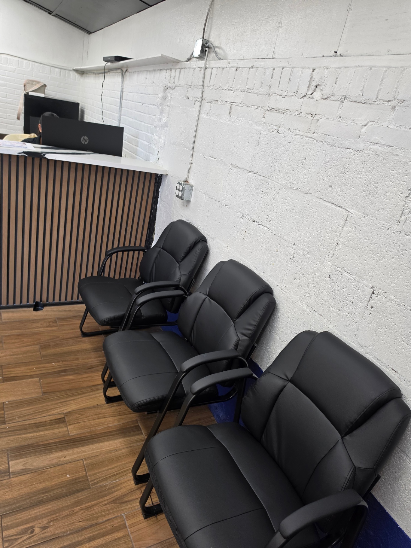 Clean waiting room with seating for customers