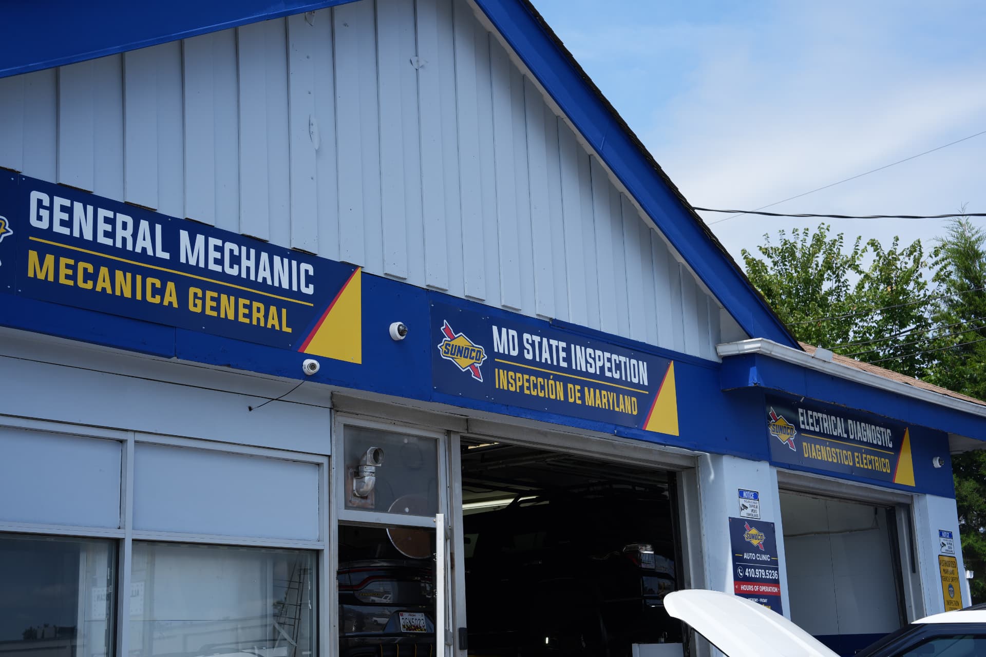 Sunoco Auto Repair shop signage listing general mechanic, Maryland State Inspection and electrical diagnostic services